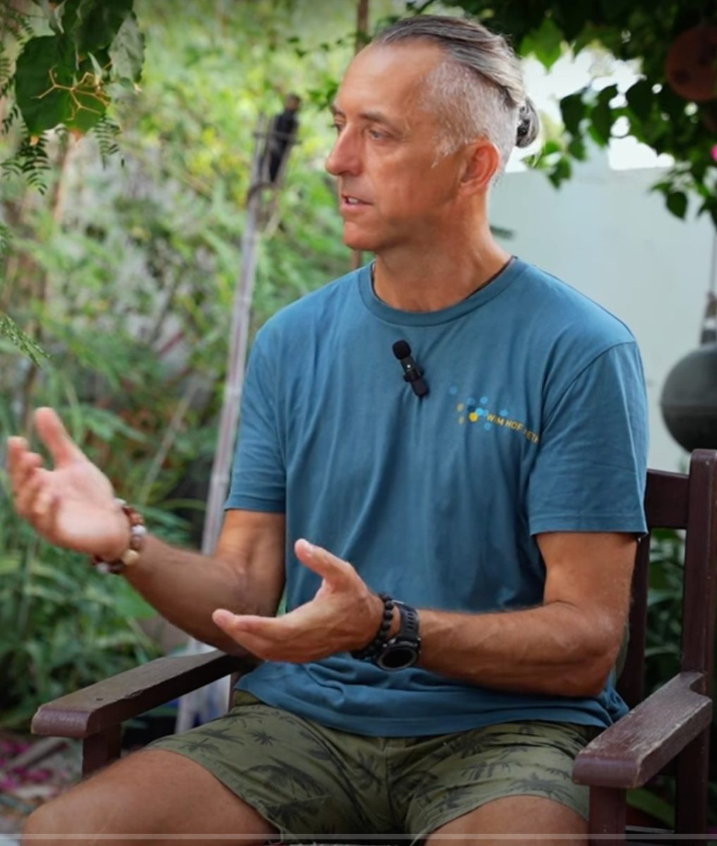 Thomas speaking during a podcast recording in a garden